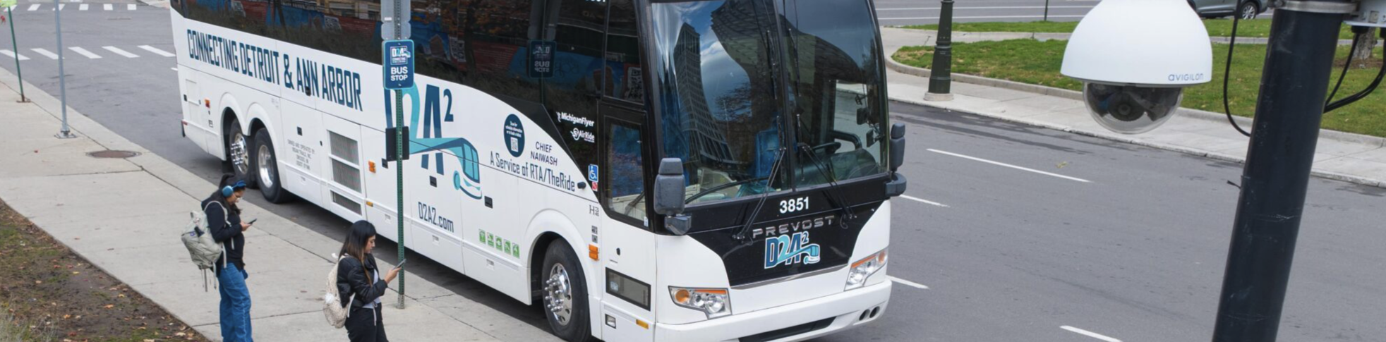 d2a2 bus driving down street