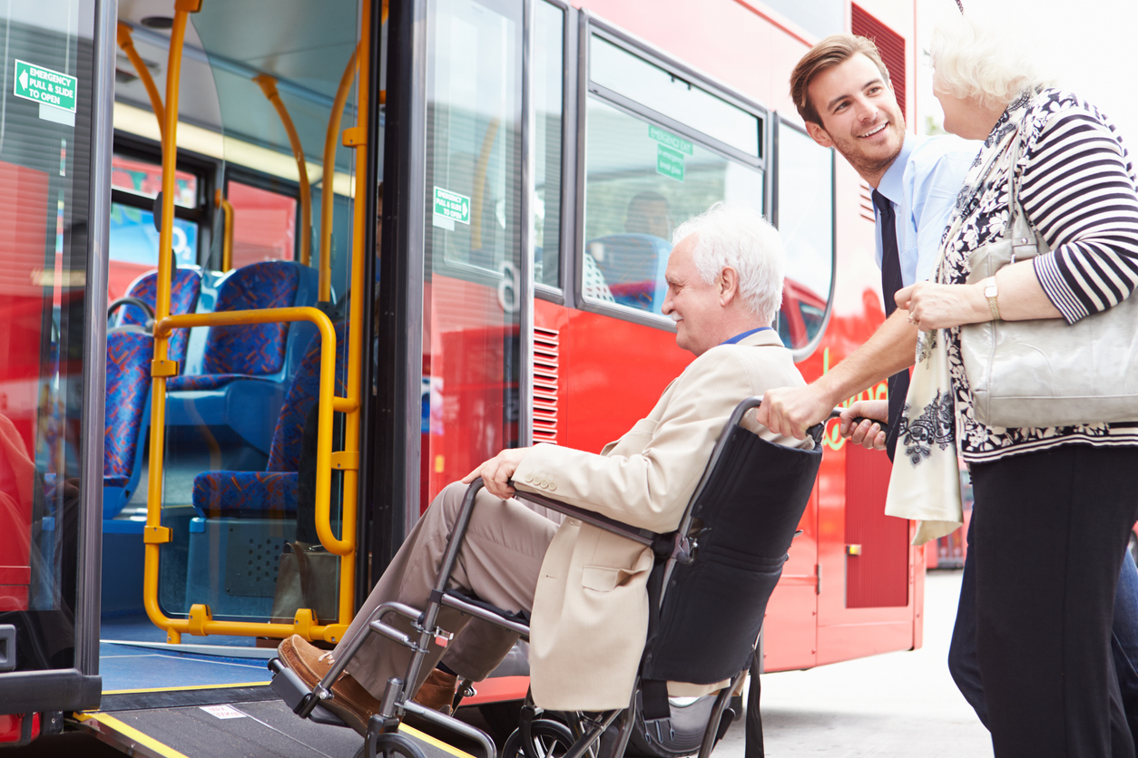person entering bus in wheelchair
